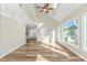 Open-concept living room with vaulted ceilings, modern hardwood floors, and ample natural light from large windows at 1609 Harbor Dr., North Myrtle Beach, SC 29582