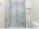 Large walk-in shower with marble tile and glass enclosure at 1609 Harbor Dr., North Myrtle Beach, SC 29582