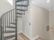 Spiral staircase with wood floor inside the residence at 1609 Harbor Dr., North Myrtle Beach, SC 29582