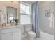 Clean bathroom with white vanity, bathtub, and hexagon tile at 1623 Sayebrook Pkwy., Myrtle Beach, SC 29588