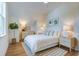 Spacious bedroom with a white bed and light wood furniture at 1623 Sayebrook Pkwy., Myrtle Beach, SC 29588