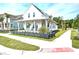 Charming white farmhouse with a front porch and landscaped yard at 1623 Sayebrook Pkwy., Myrtle Beach, SC 29588