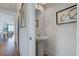 Small powder room with pedestal sink and oval mirror at 1623 Sayebrook Pkwy., Myrtle Beach, SC 29588