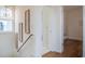Upstairs hallway with hardwood floors and decorative wall art at 1623 Sayebrook Pkwy., Myrtle Beach, SC 29588