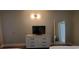 Bedroom with dresser, TV, and large mirror at 2000 N Ocean Blvd. # 1206, Myrtle Beach, SC 29577