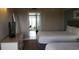Two twin beds, dresser, TV, and view into living area at 2000 N Ocean Blvd. # 1206, Myrtle Beach, SC 29577