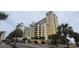 Elegant high-rise building with ocean views and palm trees at 2000 N Ocean Blvd. # 1206, Myrtle Beach, SC 29577