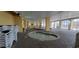 Indoor pool area with multiple hot tubs and seating at 2000 N Ocean Blvd. # 1206, Myrtle Beach, SC 29577