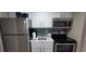Compact kitchen with stainless steel appliances at 2000 N Ocean Blvd. # 1206, Myrtle Beach, SC 29577