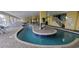 Indoor lazy river pool with seating and views at 2000 N Ocean Blvd. # 1206, Myrtle Beach, SC 29577