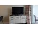 Living area with TV and stylish media console at 2000 N Ocean Blvd. # 1206, Myrtle Beach, SC 29577