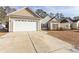 Two-car garage and front yard landscaping at 202 Sugar Mill Loop, Myrtle Beach, SC 29588