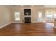 Living room with hardwood floors, fireplace, and lots of natural light at 202 Sugar Mill Loop, Myrtle Beach, SC 29588