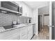 Modern kitchen with white cabinets and granite counters at 210 75Th Ave N # 4054, Myrtle Beach, SC 29572