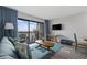 Living room with ocean view, comfy sofa, and wood-look floors at 210 75Th Ave N # 4054, Myrtle Beach, SC 29572