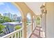 Balcony with arched entryway, white railing, and city view at 212 4Th Ave. N # 102, North Myrtle Beach, SC 29582