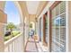 Private balcony with access from bedroom and outdoor seating at 212 4Th Ave. N # 102, North Myrtle Beach, SC 29582