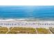 Aerial view of a beautiful beach with umbrellas and people at 212 4Th Ave. N # 102, North Myrtle Beach, SC 29582