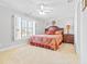 Bedroom with a queen bed, window seat, and carpeted floor at 212 4Th Ave. N # 102, North Myrtle Beach, SC 29582