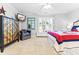 Bright bedroom with large window, comfortable seating, and TV at 212 4Th Ave. N # 102, North Myrtle Beach, SC 29582