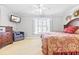 Bedroom with queen bed, window with shutters, and dresser at 212 4Th Ave. N # 102, North Myrtle Beach, SC 29582