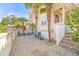 Inviting front patio with brick pavers and palm trees at 212 4Th Ave. N # 102, North Myrtle Beach, SC 29582