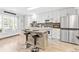 Modern kitchen with white shaker cabinets, granite countertops, and an island at 212 4Th Ave. N # 102, North Myrtle Beach, SC 29582