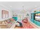 Bright living room with comfortable seating, a large TV, and access to a balcony at 212 4Th Ave. N # 102, North Myrtle Beach, SC 29582