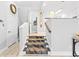 Modern stairs with a leopard print runner leading upstairs at 212 4Th Ave. N # 102, North Myrtle Beach, SC 29582