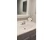 White bathroom vanity with a chrome faucet and mirror at 2406 N Ocean Blvd. # Ph4-1704, Myrtle Beach, SC 29577