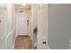 Gray hallway with wood-look flooring, doors, and stairs at 2406 N Ocean Blvd. # Ph4-1704, Myrtle Beach, SC 29577