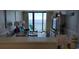 Living room with ocean view, balcony access, and comfortable seating at 2406 N Ocean Blvd. # Ph4-1704, Myrtle Beach, SC 29577