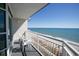 Balcony with chairs overlooking the beach and ocean, perfect for relaxing at 2504 N Ocean Blvd. # 832, Myrtle Beach, SC 29577