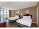 Bright bedroom featuring two beds, beachfront views, and natural light at 2504 N Ocean Blvd. # 832, Myrtle Beach, SC 29577