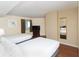 Bedroom featuring two beds, a window with curtains, a dresser with a TV, and a mirror on the wall at 2504 N Ocean Blvd. # 832, Myrtle Beach, SC 29577