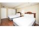 Bedroom with two beds, nightstand, closet, door to the hallway at 2504 N Ocean Blvd. # 832, Myrtle Beach, SC 29577