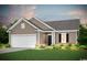 Two-story Craftsman style home with neutral siding and a two-car garage at 272 Hawks Run Dr., Calabash, NC 28467