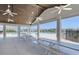 Covered patio area with picnic tables overlooking the community pool at 272 Hawks Run Dr., Calabash, NC 28467