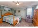 Spacious main bedroom with a king-size bed and wood furniture at 3040 Thoroughfare Dr., Conway, SC 29526