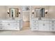 Bathroom featuring dual sink vanities with black fixtures and lighting at 3220 Highway 19, Conway, SC 29526