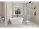 Bathroom featuring a standalone tub and glass-enclosed shower at 3220 Highway 19, Conway, SC 29526