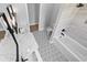 Stylish bathroom showcasing double vanities, decorative tile floor, and separate tub and shower at 3220 Highway 19, Conway, SC 29526