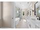 Luxurious bathroom featuring a standalone tub, glass-enclosed shower, and dual vanities at 3220 Highway 19, Conway, SC 29526