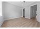 Comfortable bedroom showcasing wood flooring, an open door and a closet at 3220 Highway 19, Conway, SC 29526