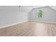Bright bedroom featuring hardwood floors and a window, offering natural light and a cozy atmosphere at 3220 Highway 19, Conway, SC 29526