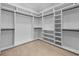 Spacious walk-in closet with custom shelving and ample storage space for clothes and accessories at 3220 Highway 19, Conway, SC 29526