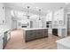 Bright, open kitchen boasts a gray island, stainless appliances, and a coffered ceiling at 3220 Highway 19, Conway, SC 29526