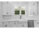 The kitchen features white cabinets, white subway tile backsplash, and stainless steel appliances at 3220 Highway 19, Conway, SC 29526