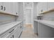 Well-lit laundry room with ample counter space, custom cabinetry, and modern fixtures at 3220 Highway 19, Conway, SC 29526