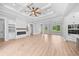 Spacious living room featuring built-in shelving, fireplace, and large windows at 3220 Highway 19, Conway, SC 29526